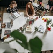 woman sitting at a table working together