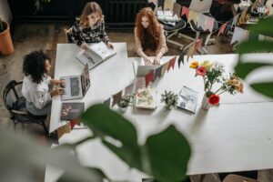 woman sitting at a table working together