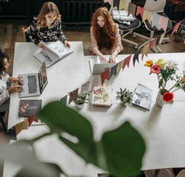 woman sitting at a table working together
