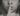 grayscale photo of woman doing silent hand sign