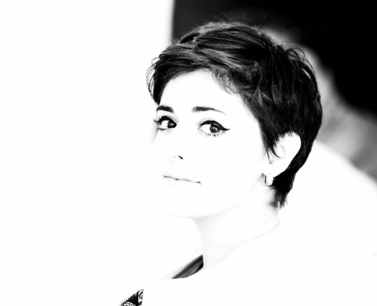 woman in black shirt grayscale photo